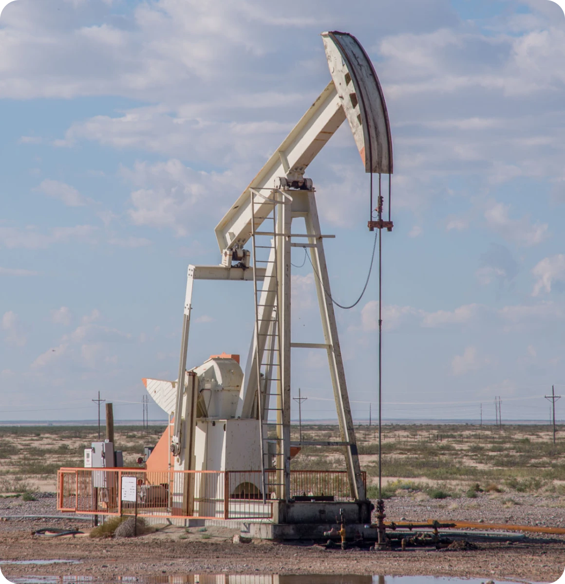 Oil pumpjack under a blue sky